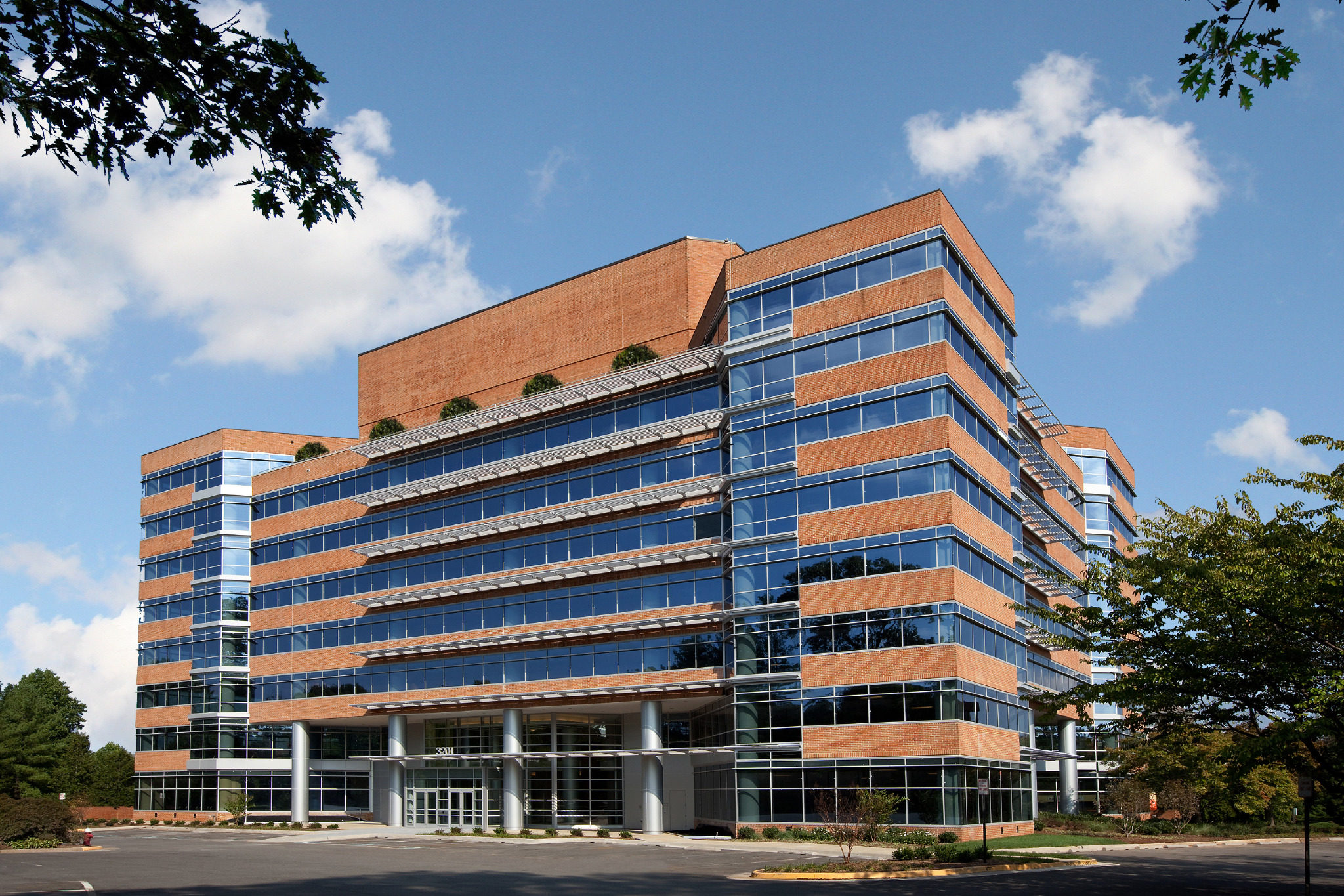 Exterior view of a large brick and glass office building